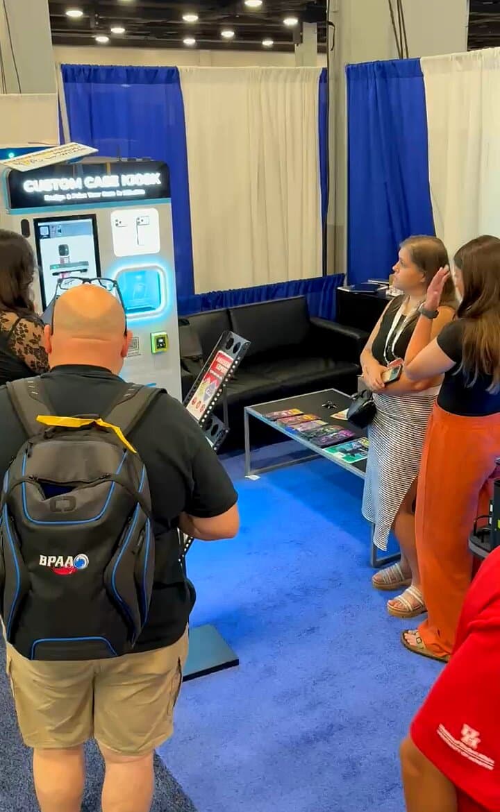 Attendees gathered around the Custom Case Kiosk booth at Bowl Expo 2026