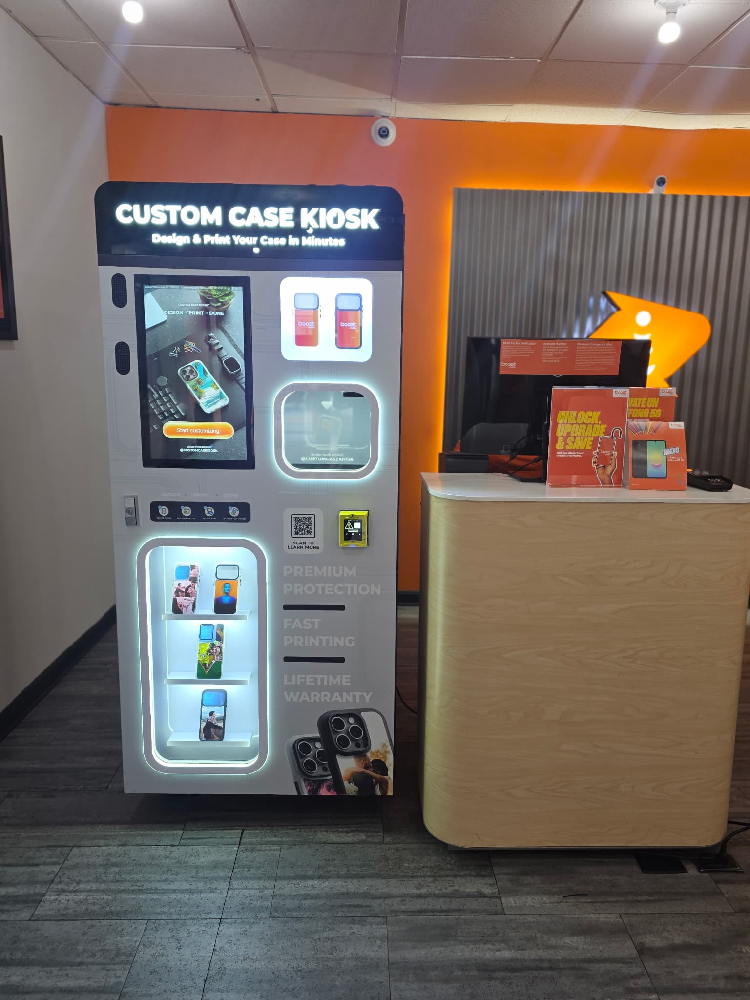 Custom Case Kiosk inside Boost Mobile in Riverside, New Jersey — CCK-V4 unit beside the service counter