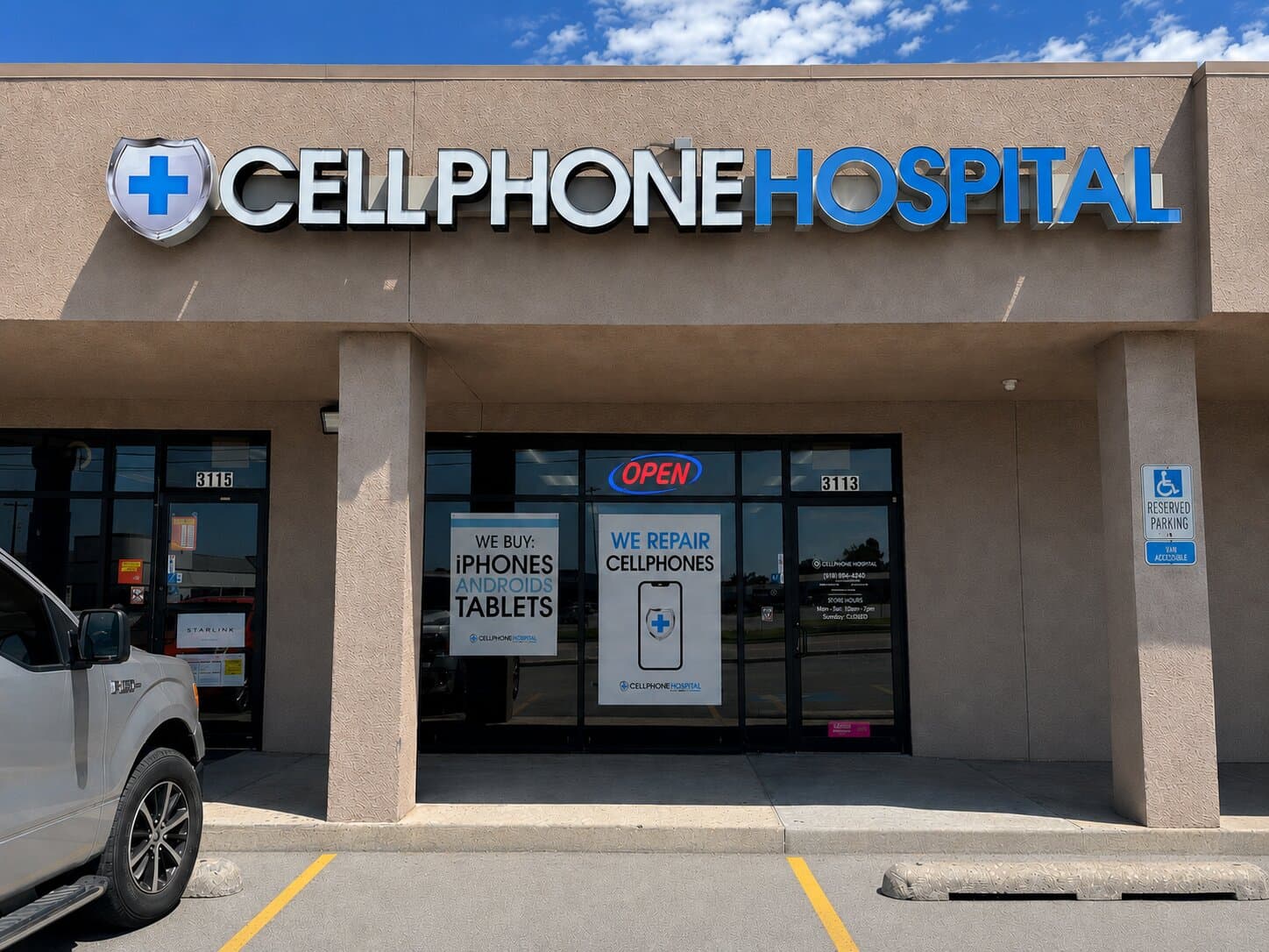 Storefront of Cellphone Hospital at 3119 S Garnett Rd in east Tulsa, OK — illuminated CELLPHONE HOSPITAL sign above the entrance